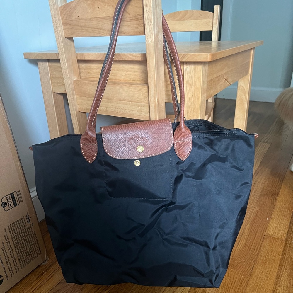 Brand new, never used black, large Longchamp Le Pliage Tote.